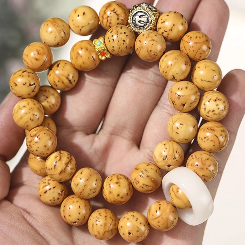 Purple gold rat bodhi seed double wrap bracelet lifestyle product shot
