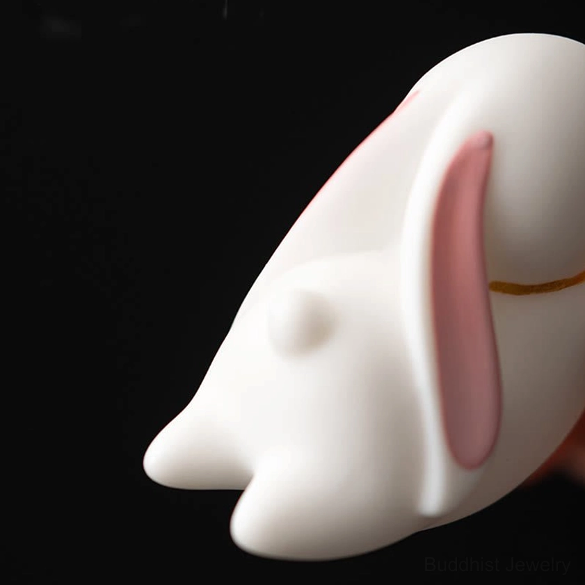 Ceramic rabbit incense burner lifestyle photograph with incense and calm meditation atmosphere