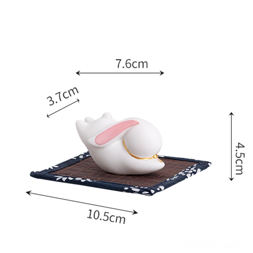 Ceramic rabbit incense burner product display showing size specifications with blue floral bamboo mat included