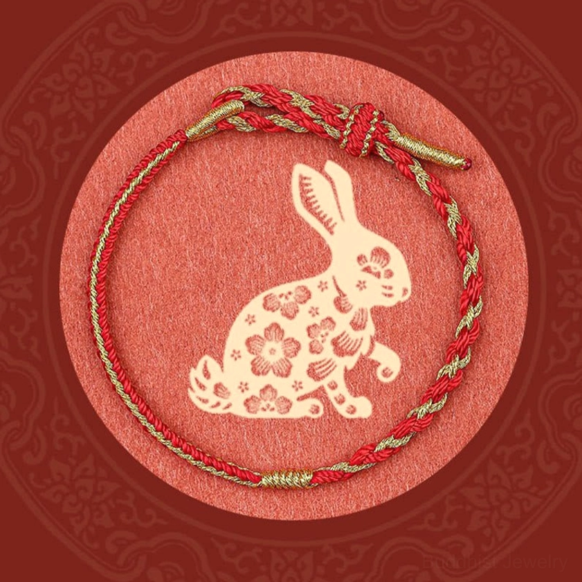 Zodiac rabbit Buddhist protection bracelet with red-gold woven cord and traditional paper cut ornament