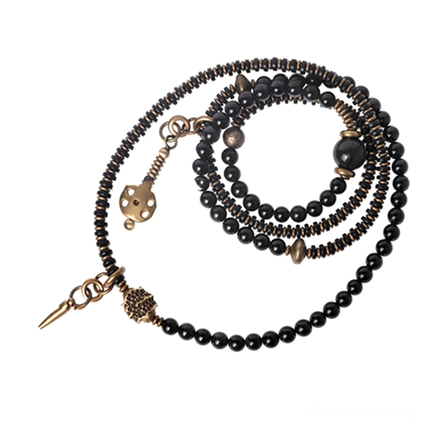 Handmade craftsmanship detail of rainbow obsidian ebony wood copper Buddhist bracelet showing artisan quality and natural material authenticity