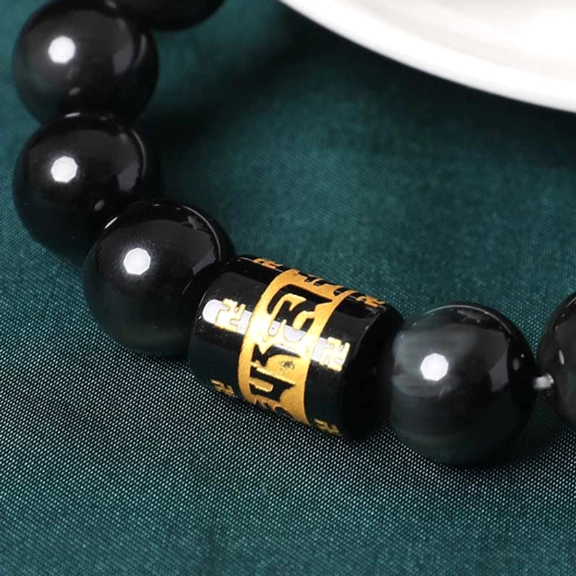 Rainbow obsidian prayer bracelet for meditation and spiritual practice - lifestyle shot