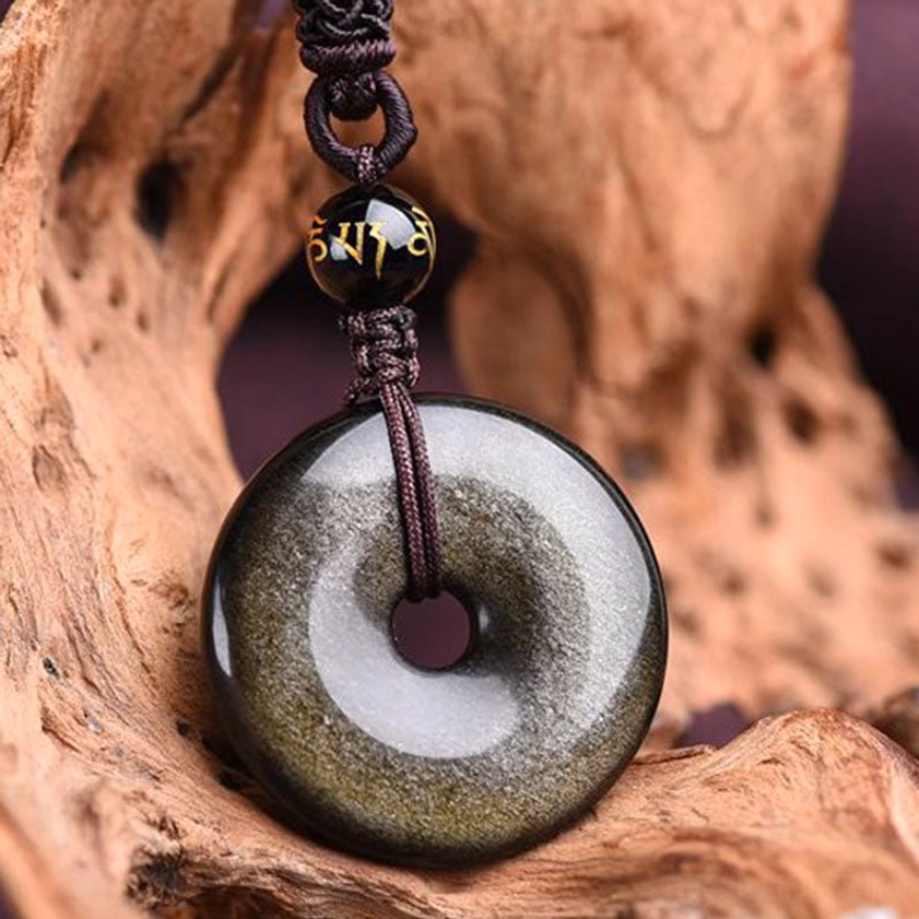 Rainbow obsidian donut pendant iridescent colors bright light reflection
