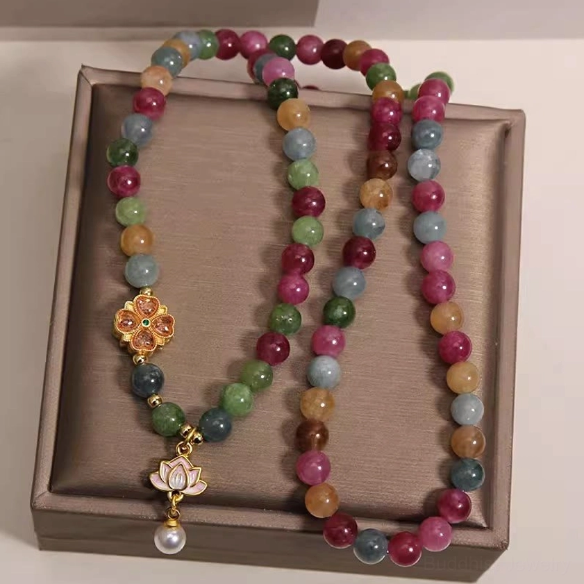 Rainbow tourmaline beaded bracelet side angle view showing loose bead strands and lotus pendant