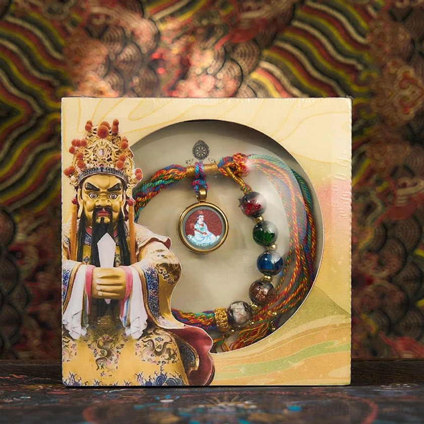 Rat zodiac Thousand-Armed Avalokitesvara natal Buddha bracelet on palm, featuring multicolor silk braid and spiritual guardian pendant
