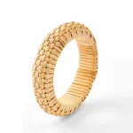 Hand-woven rattan grounding bangle bracelet with intricate checkerboard weave pattern, light tan color, front studio view