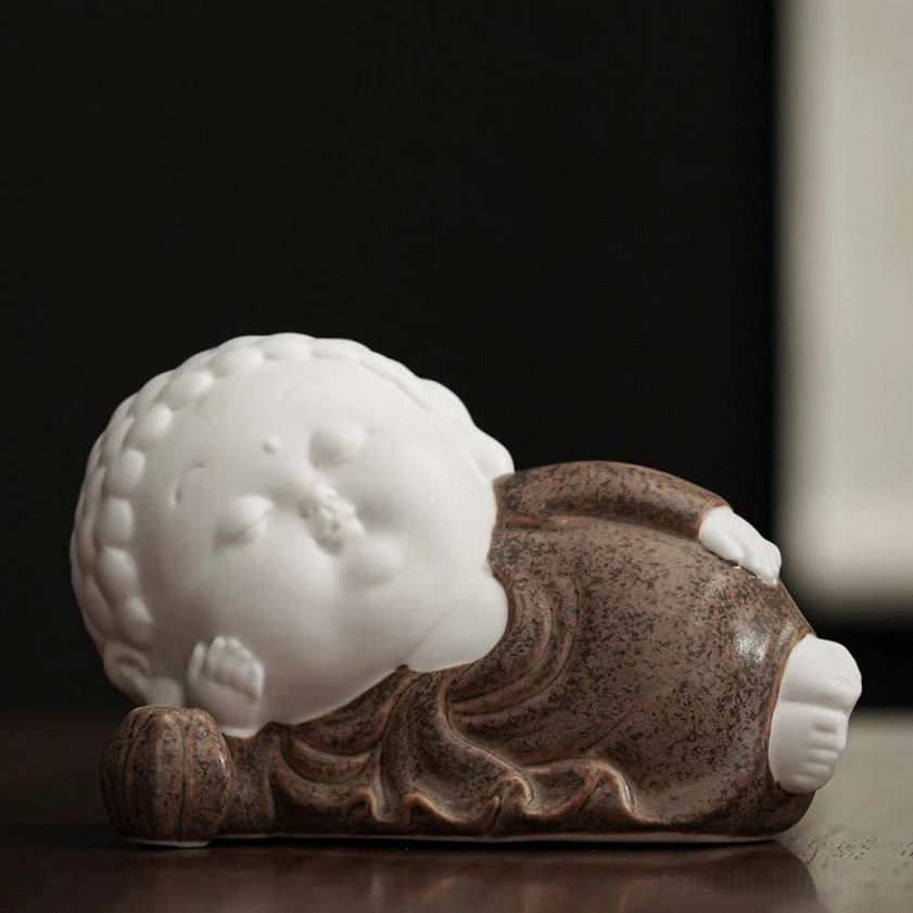 Reclining Buddha ceramic incense burner with white body and glazed robes - full length peace pose display