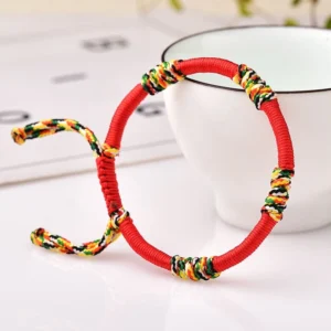 Red adjustable King Kong knot Buddhist bracelet with colorful woven knots and braided rope tail for protection and good fortune
