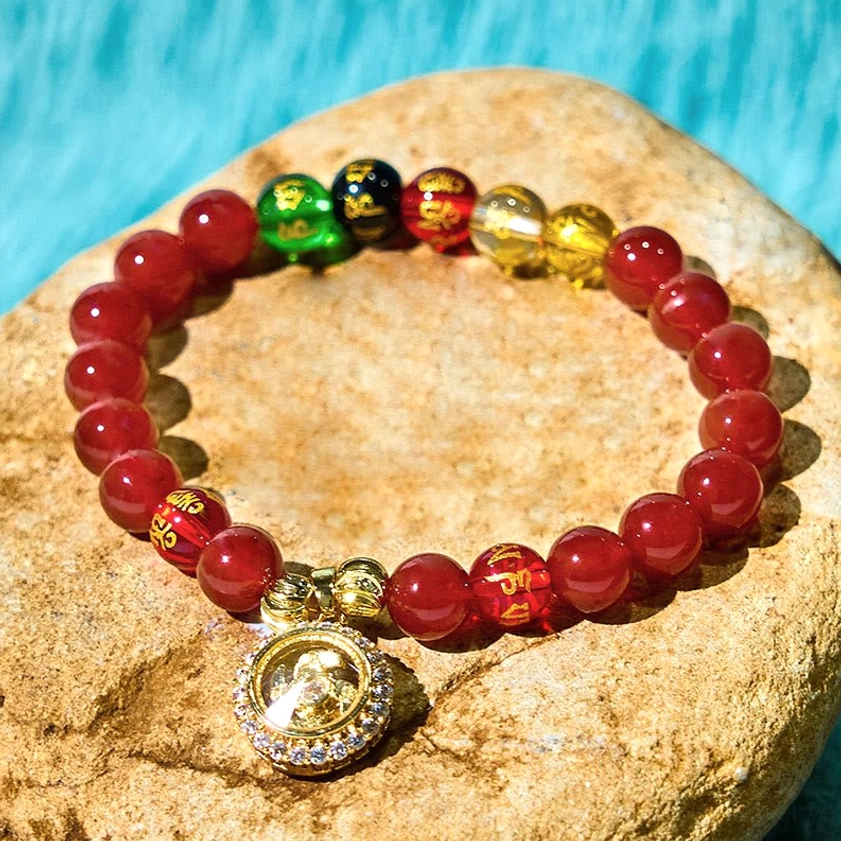 Red agate Buddhist bracelet with diamond-encrusted 18K gold-plated charm on natural stone