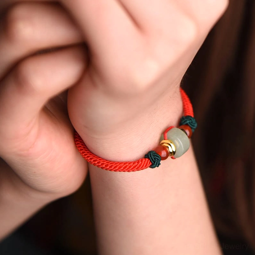 Red agate and green aventurine Buddhist protection bracelet with braided string design
