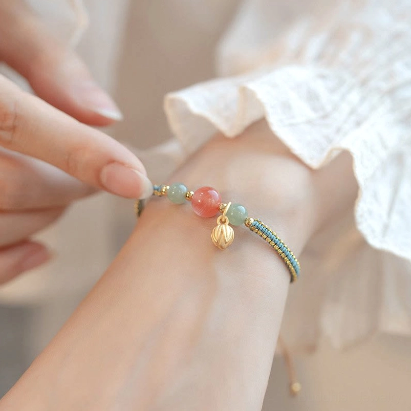 Adjustable red agate jade bracelet wearing tutorial with white blouse