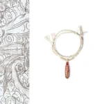 Red agate nine-eye dzi bead buddhist bracelet with white geometric patterns on beige braided rope, traditional spiritual jewelry design