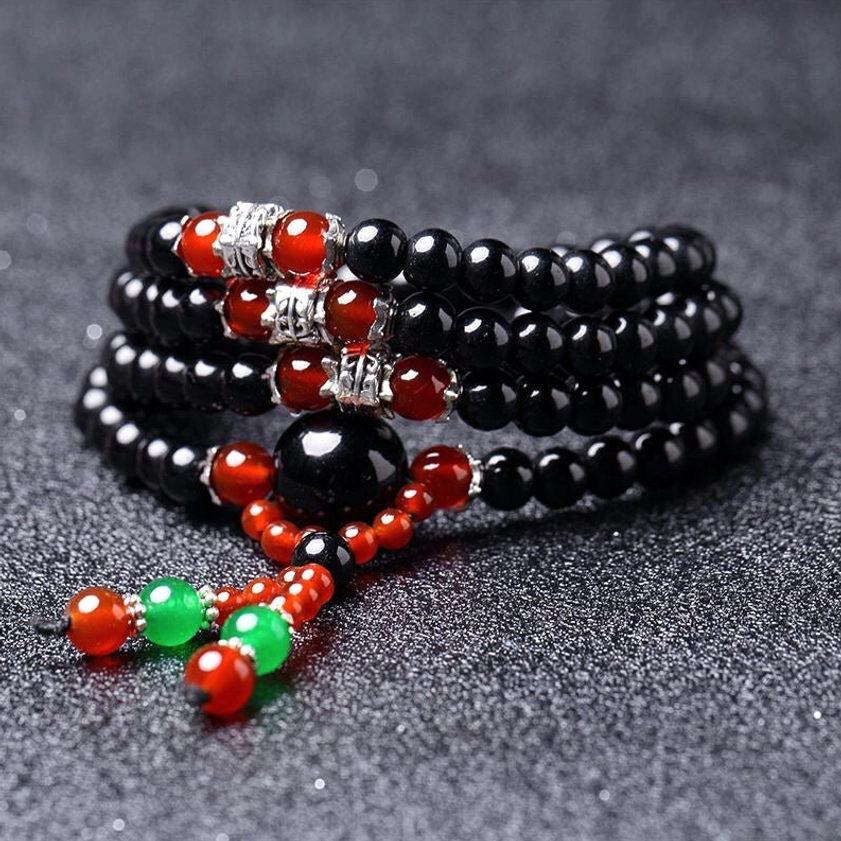 Red agate variant 108 bead Buddhist mala bracelet combining black obsidian and red agate for emotional healing and confidence