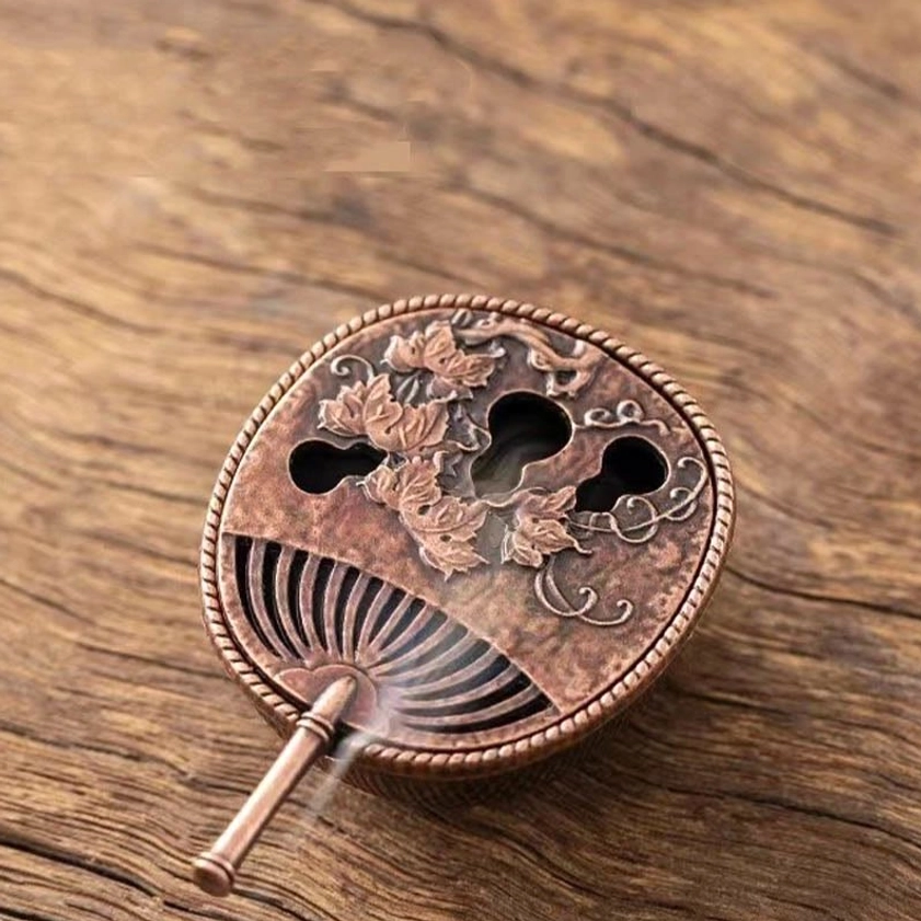 Red bronze gourd fan incense burner with carved gourd vine patterns and fan-shaped vents