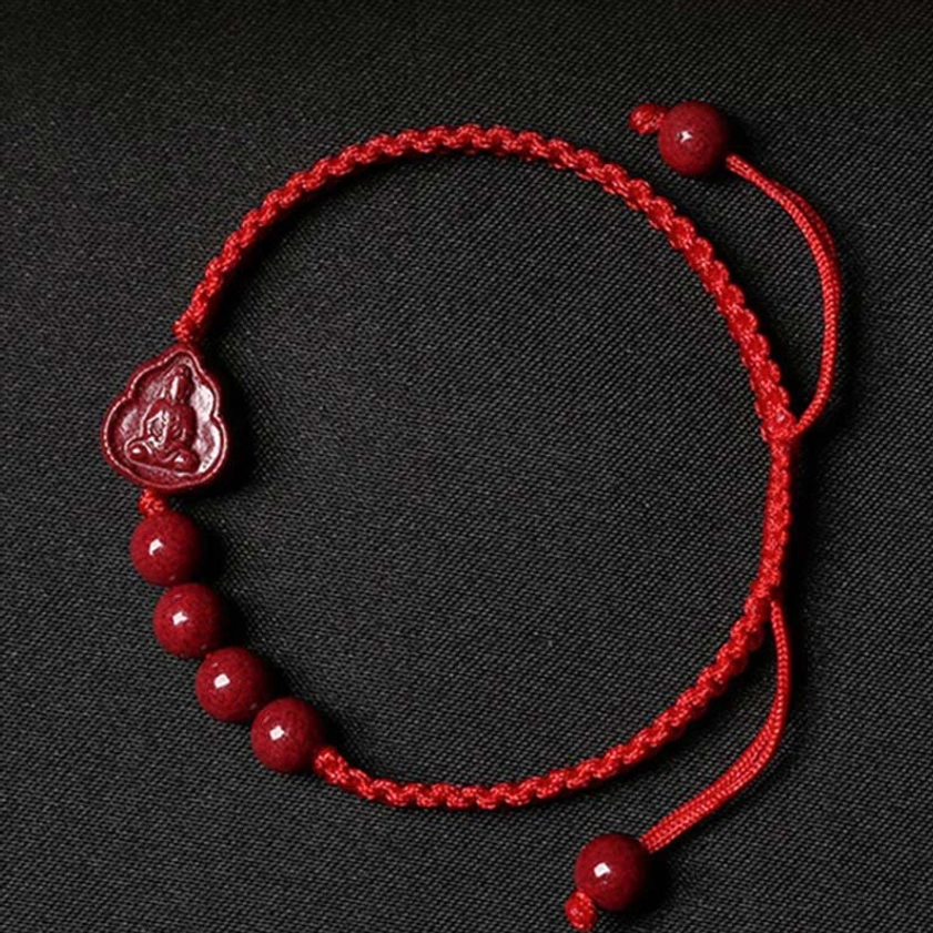 Red cinnabar Buddha blessing bracelet with adjustable red string cord, featuring 6mm round beads and Buddha pendant