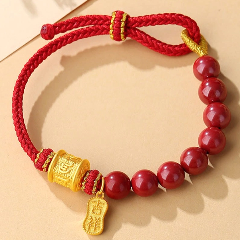 Red woven cord with sterling silver accents and cinnabar - texture and craftsmanship detail