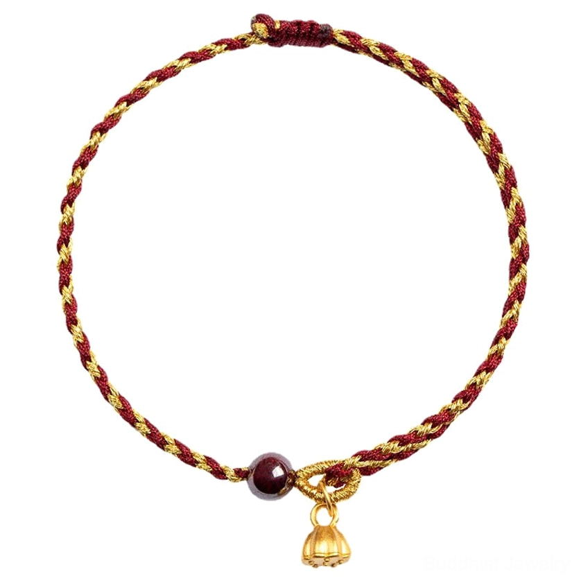 Red gold braided Buddhist bracelet with dark bead and gold lotus pendant on white background