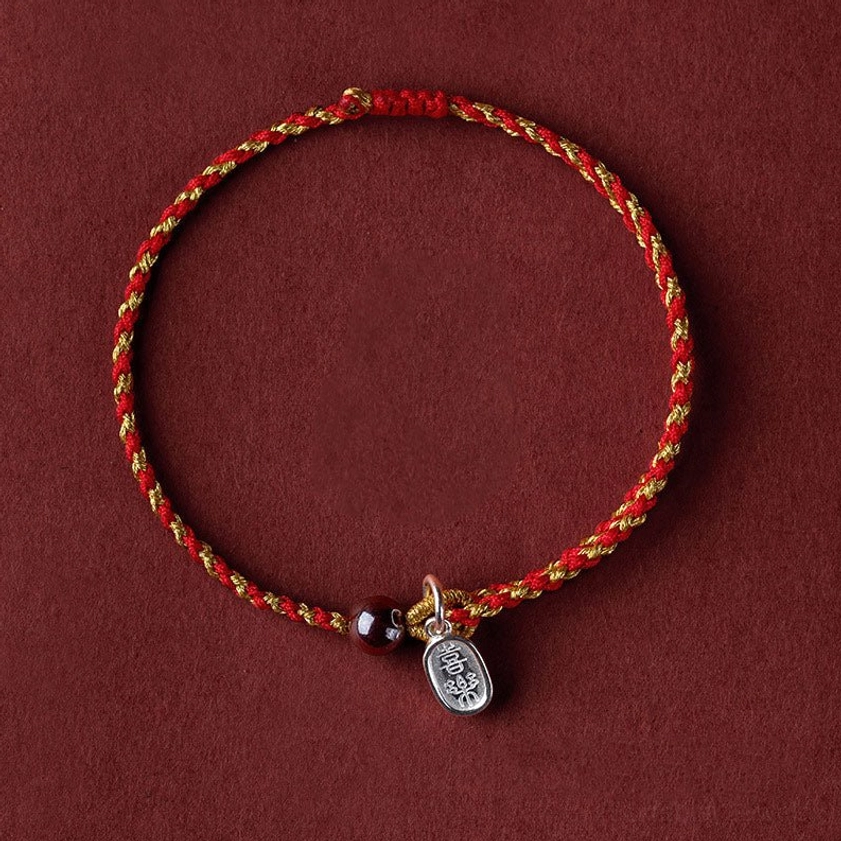 Red gold braided Buddhist bracelet with peace and joy charm - wearable spiritual protection