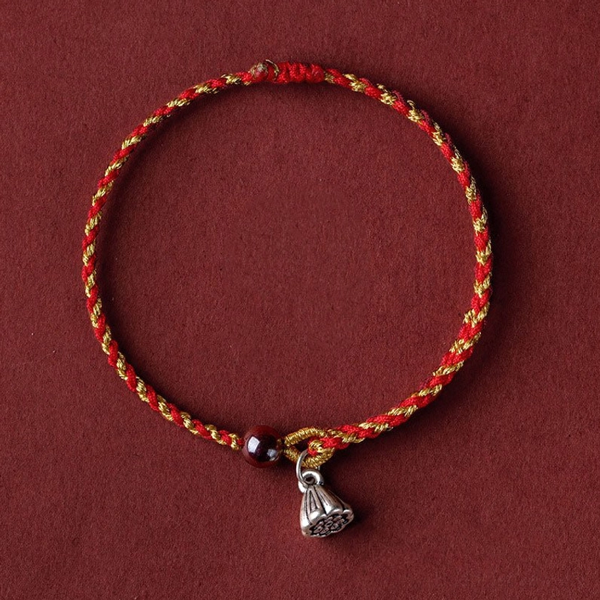 Silver lotus pod charm bracelet in red gold braid - elegant Buddhist jewelry