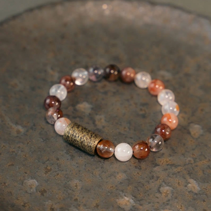 Red hematoid quartz crystal bracelet featuring deep red stone beads for protection and grounding