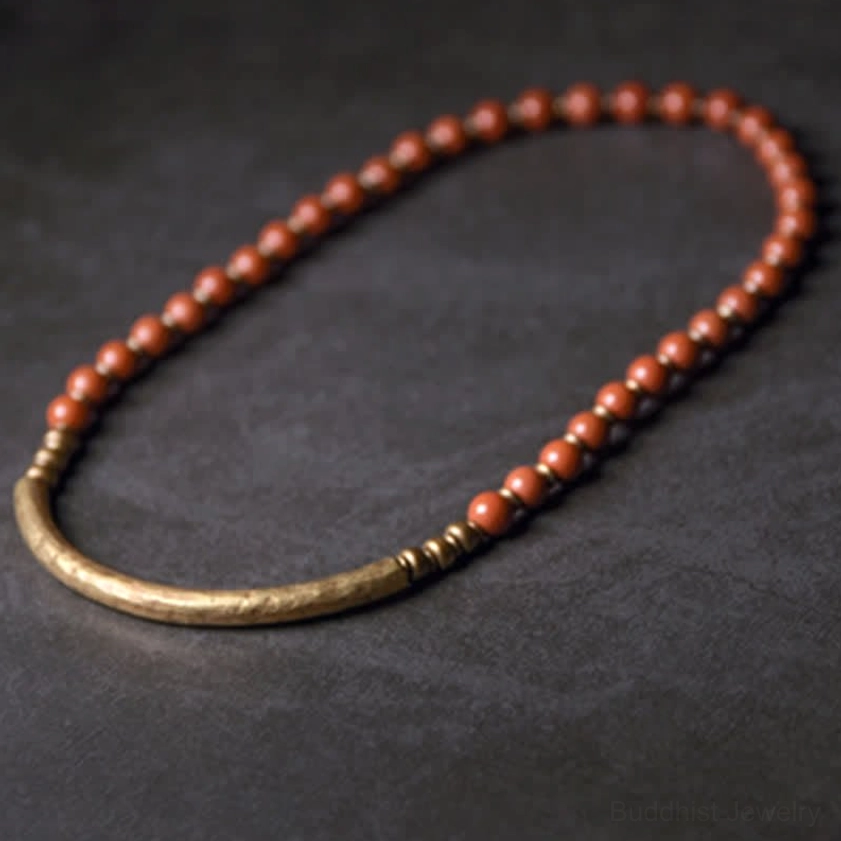 Red jasper and copper couple bracelet arranged in arc formation - flat lay showing crystal healing bracelet design