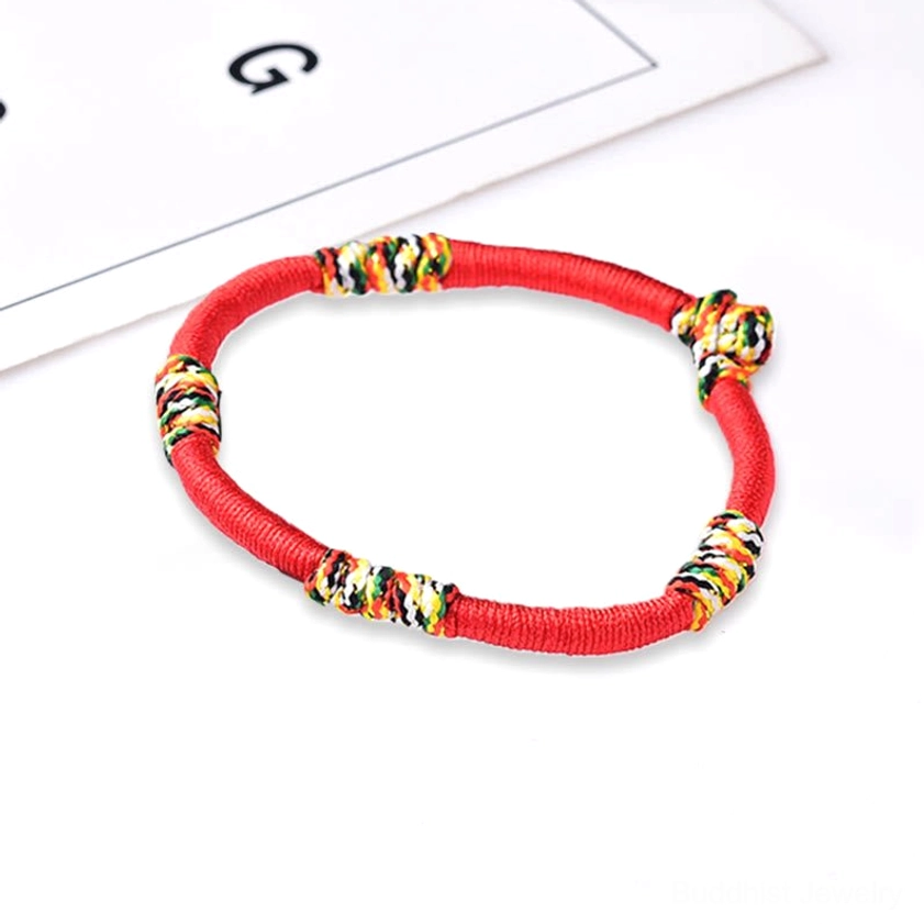 Red King Kong knot Buddhist bracelet with vibrant colorful knots both ends showcasing full design