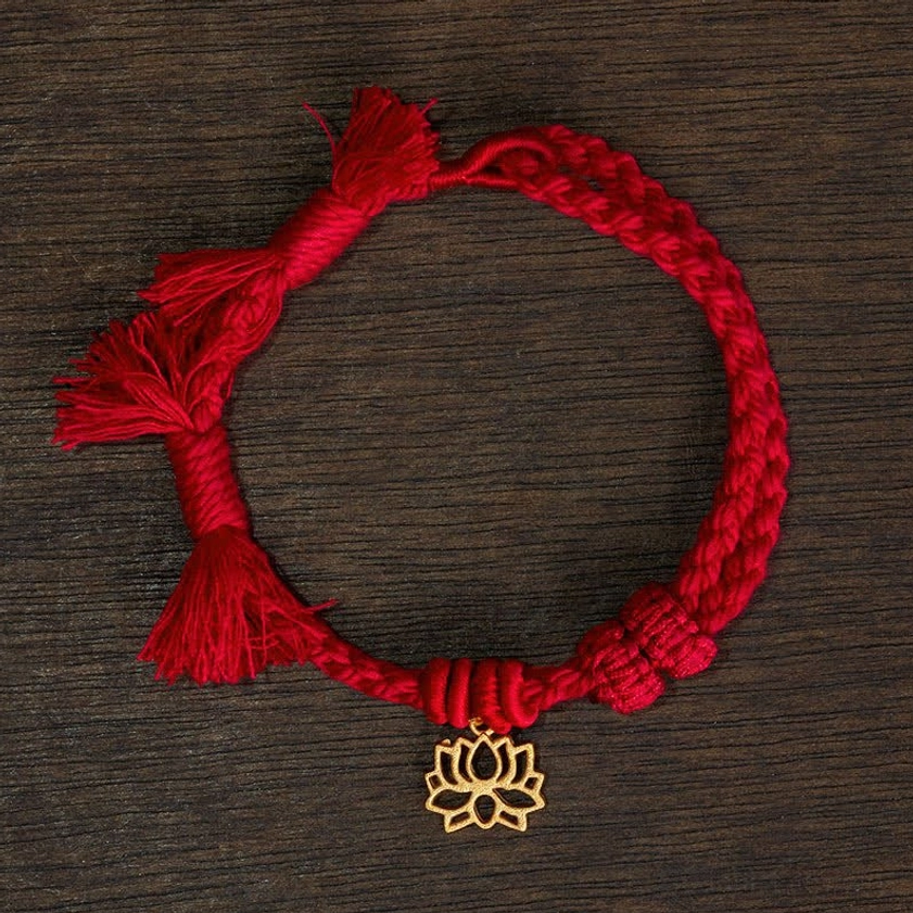 Red lotus bracelet display showing complete product with adjustable cord fit for various wrist sizes