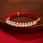 Red Buddhist peach blossom knot bracelet with gold thread, handwoven adjustable string bracelet for protection and prosperity
