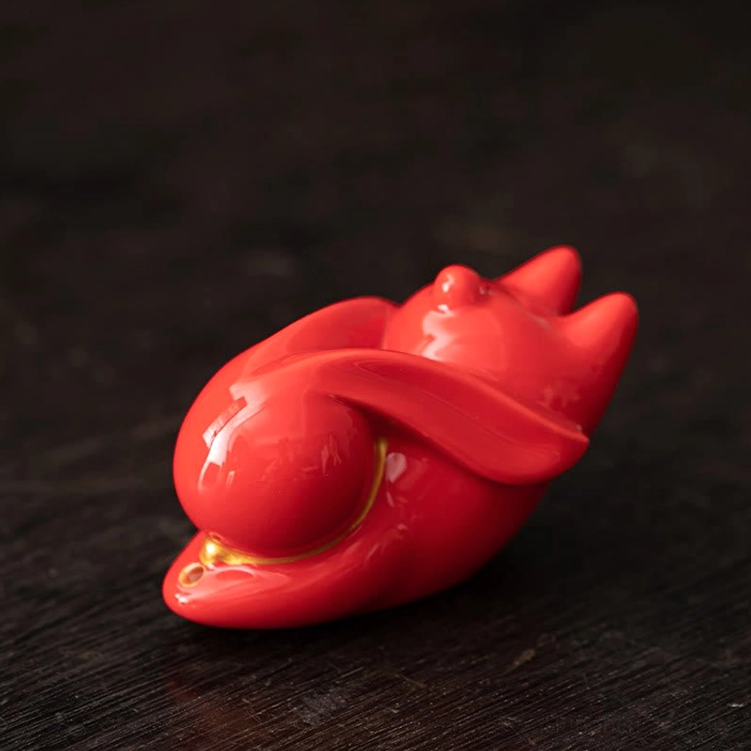 Red ceramic rabbit incense burner single piece showcase on dark wooden surface