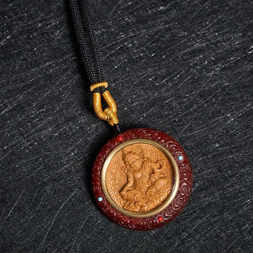 Red sandalwood Bodhisattva Tara pendant front close-up with colored bead inlays and carved religious figure