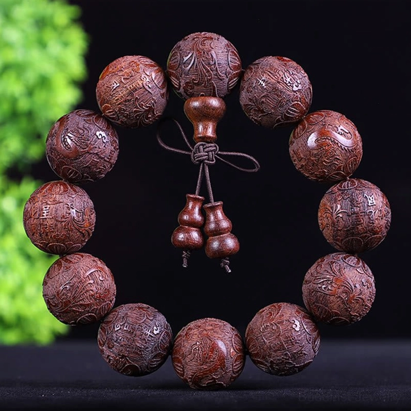Reddish-brown wooden Buddhist bracelet with embossed round beads and traditional gourd charm