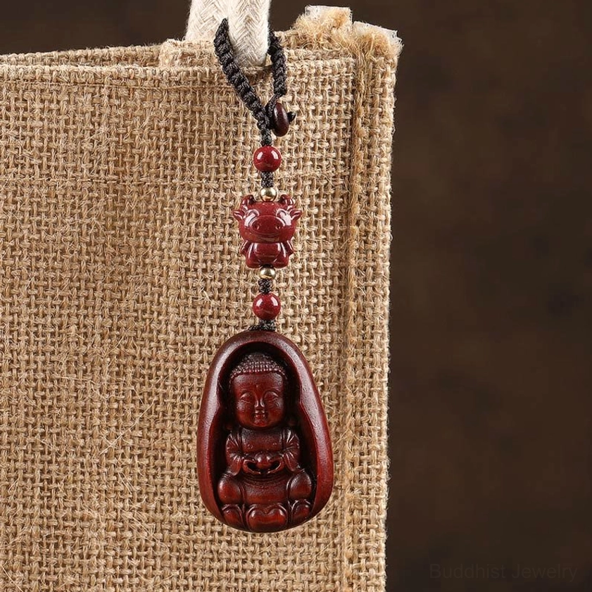 Red sandalwood Buddha zodiac keychain collection showing all 12 zodiac animals with natural wood texture