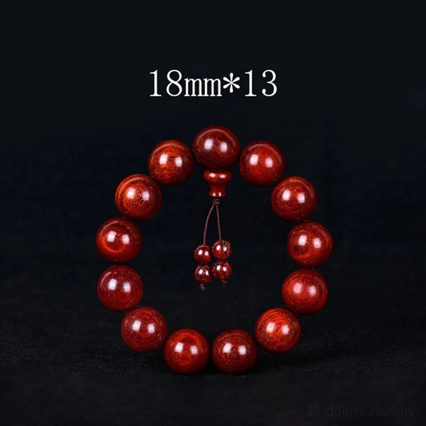Red sandalwood buddhist mala beads close-up showing natural wood grain and polish quality detail