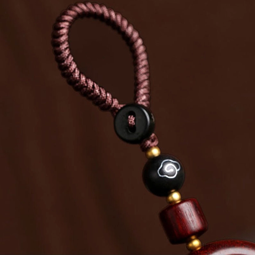 Red sandalwood and ebony rotating prayer keychain with ebony blessing design carved sphere