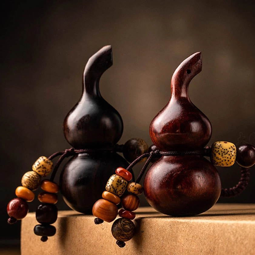 Red sandalwood gourd keychain variant showing rich reddish-brown color and natural wood characteristics for longevity and balance