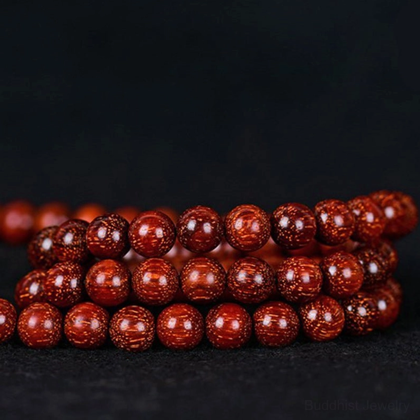 Handmade red sandalwood buddhist mala beads artisan craftsmanship showing individual bead quality
