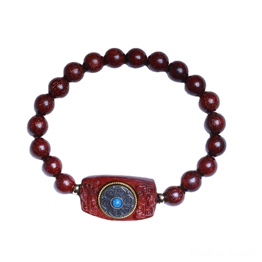 Red sandalwood Buddhist bracelet with carved focal piece and turquoise mantra inlay, premium display angle