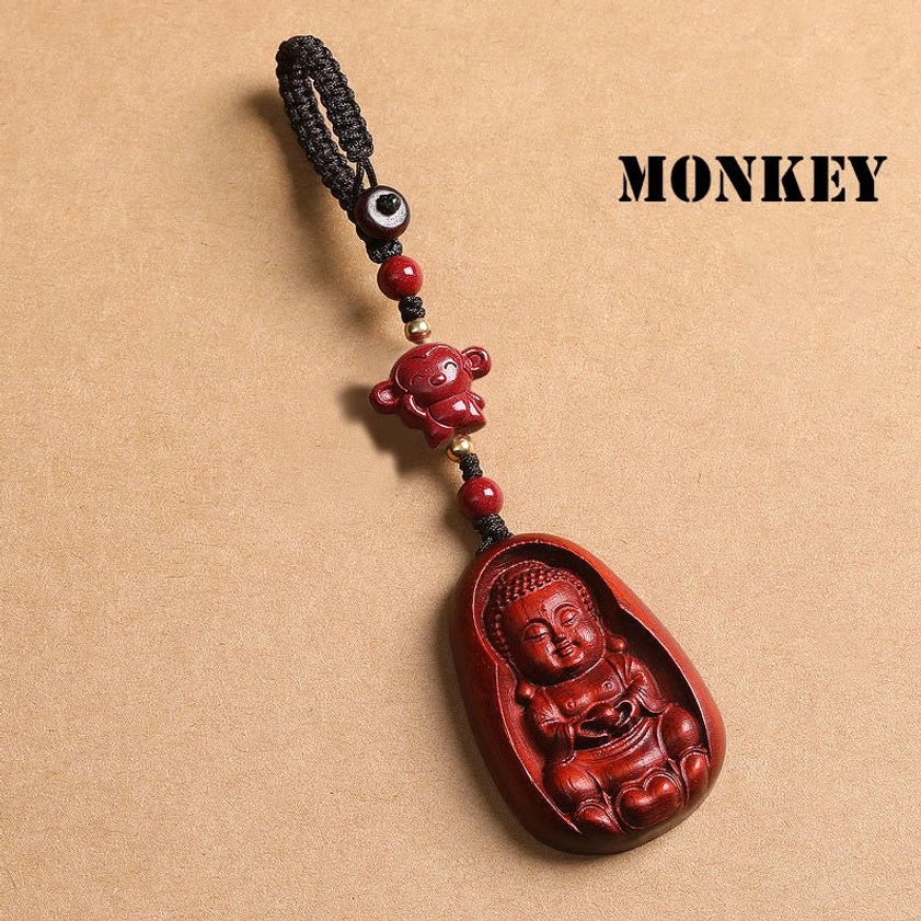 Red sandalwood Monkey zodiac Buddha keychain showing carved animal bead and braided cord attachment
