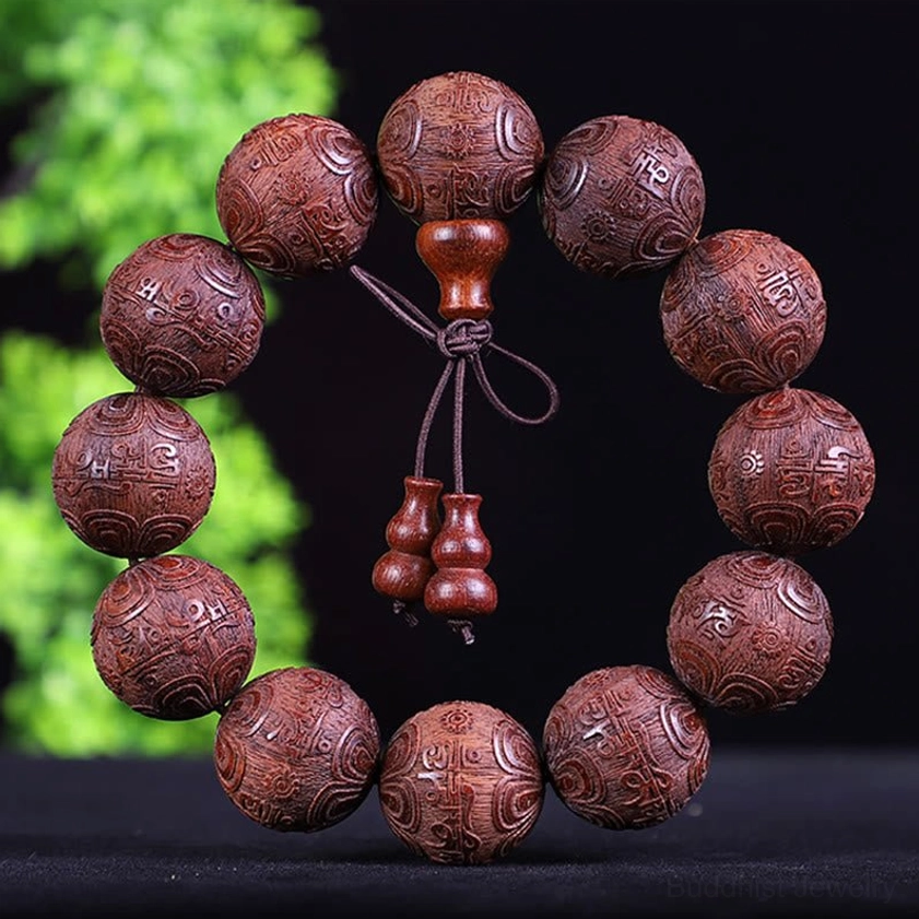 Red sandalwood zodiac bracelet featuring Om Mani Padme Hum sacred mantra carved on beads