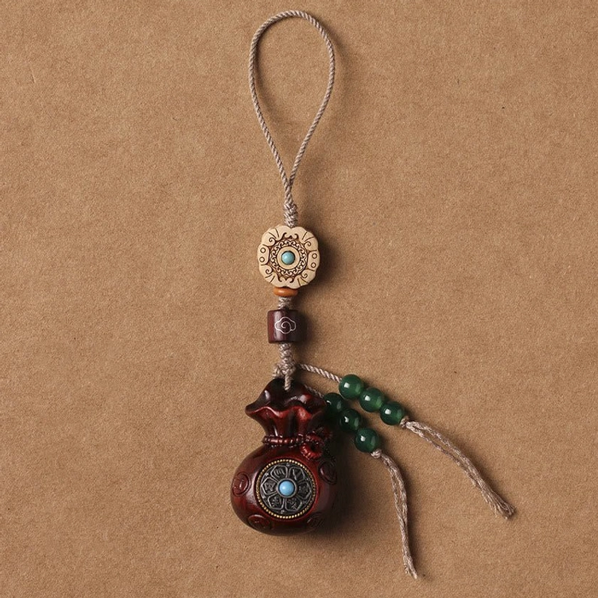 Red sandalwood Om Mani Padme Hum phone hanging charm with linen rope and green glass bead tassel vertical display
