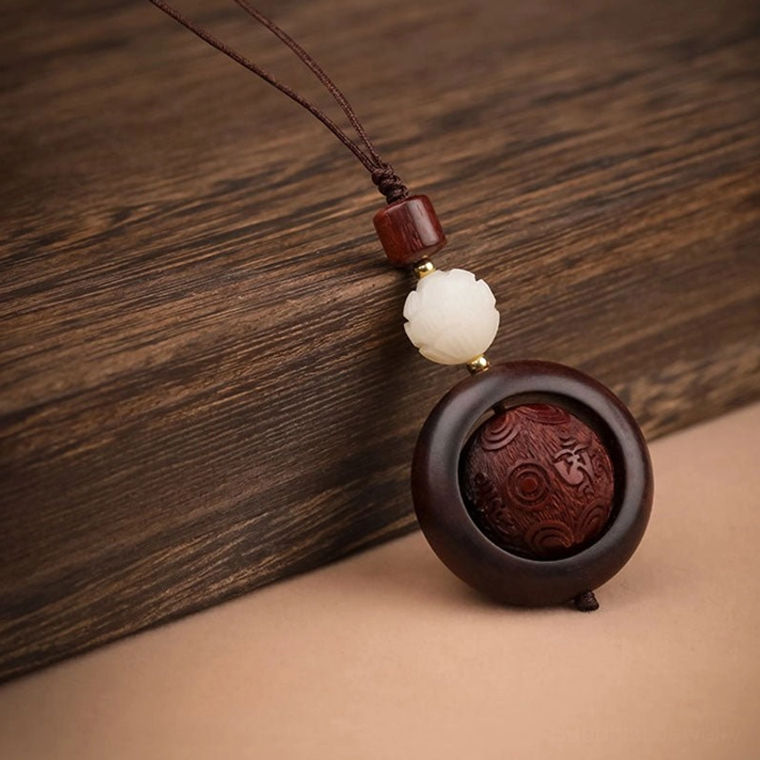 Red sandalwood prayer keychain combining six true words mantra and lotus flower carved design