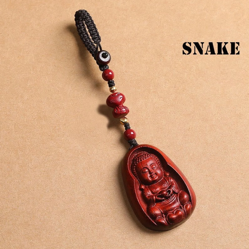 Red sandalwood Snake zodiac Buddha keychain with cinnabar accent and traditional Buddhist carving