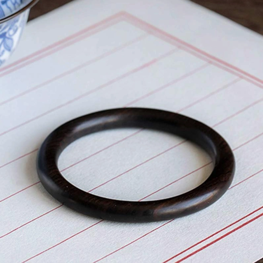 Red Sandalwood Buddhist Bangle spiritual protection - showing rich reddish-brown color and wood grain