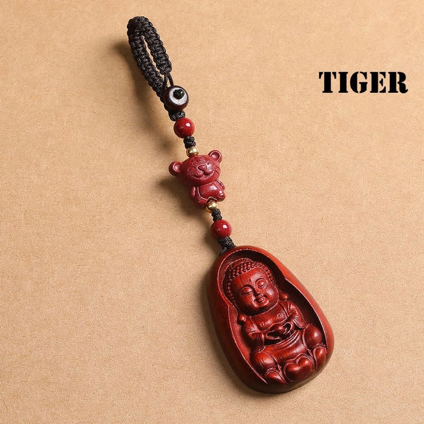 Red sandalwood Tiger zodiac Buddha keychain front flat lay on kraft paper with TIGER label and carved bead