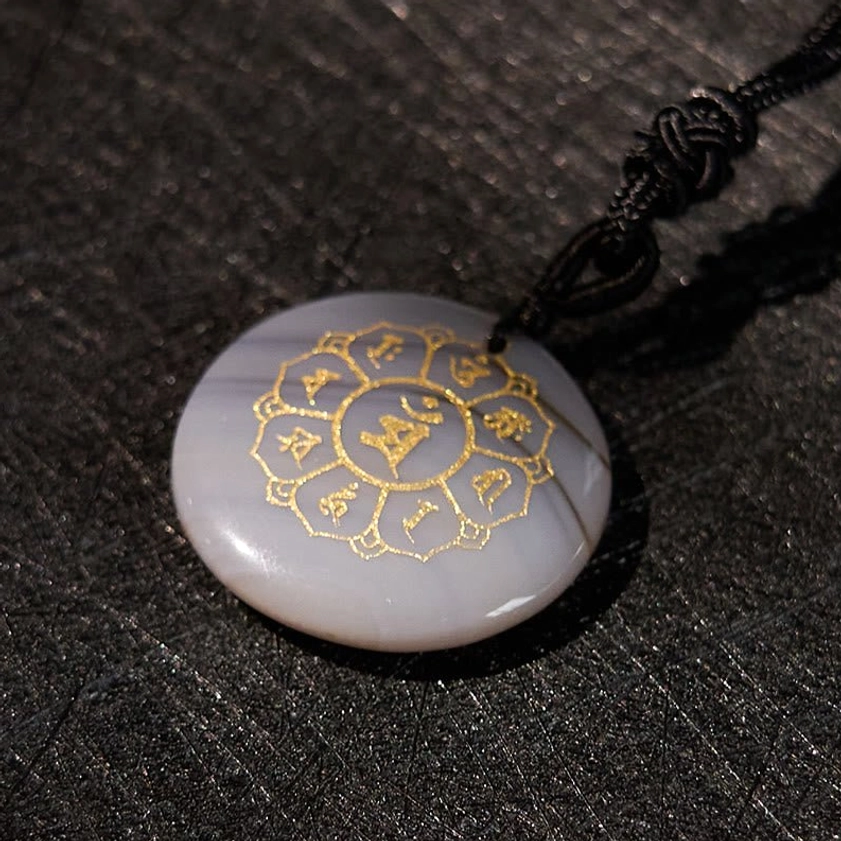 Red Stone Om Mani Padme Hum Buddhist necklace pendant with gold Sanskrit mantra and natural stone beauty