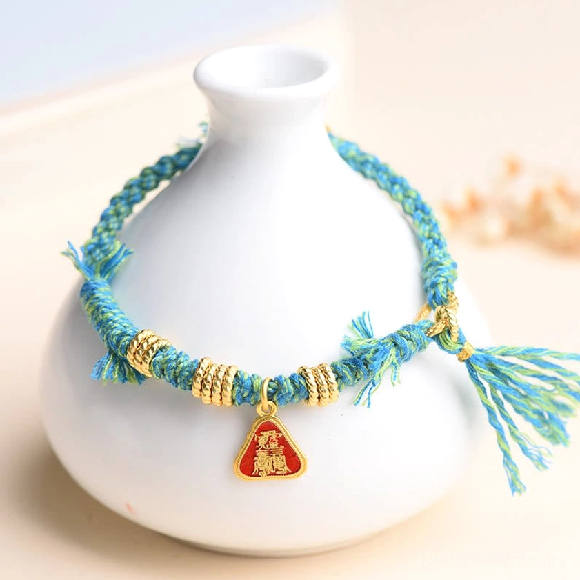 Red string Buddhist bracelet collection showing multiple color variations and styling options for spiritual protection and good fortune