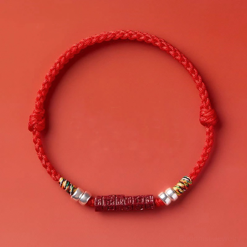 Red string bracelet close-up showing adjustable knot and secure closure for comfortable all-day wear