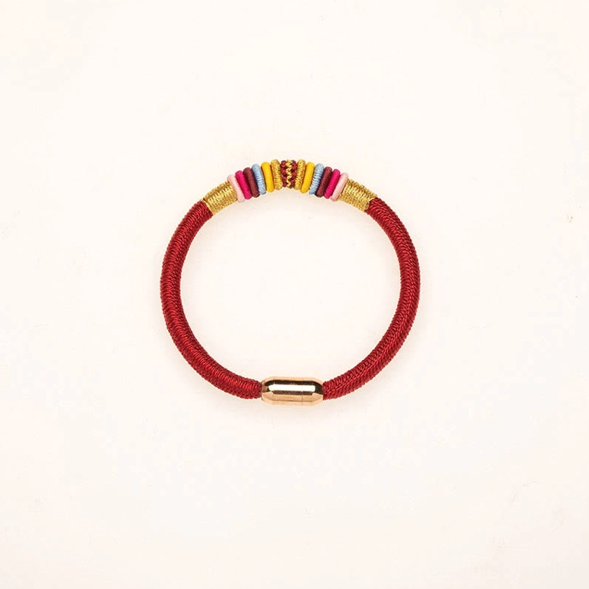 Buddhist red string bracelet with magnetic buckle showing adjustable sizing feature