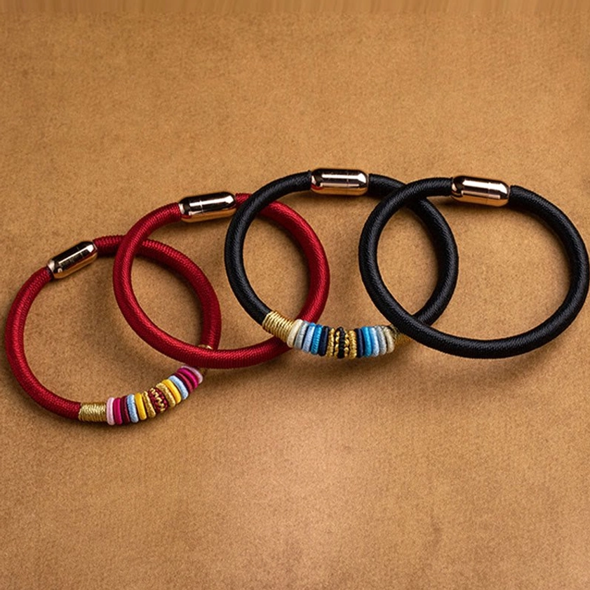 Red string Buddhist bracelet with traditional knot design and magnetic buckle