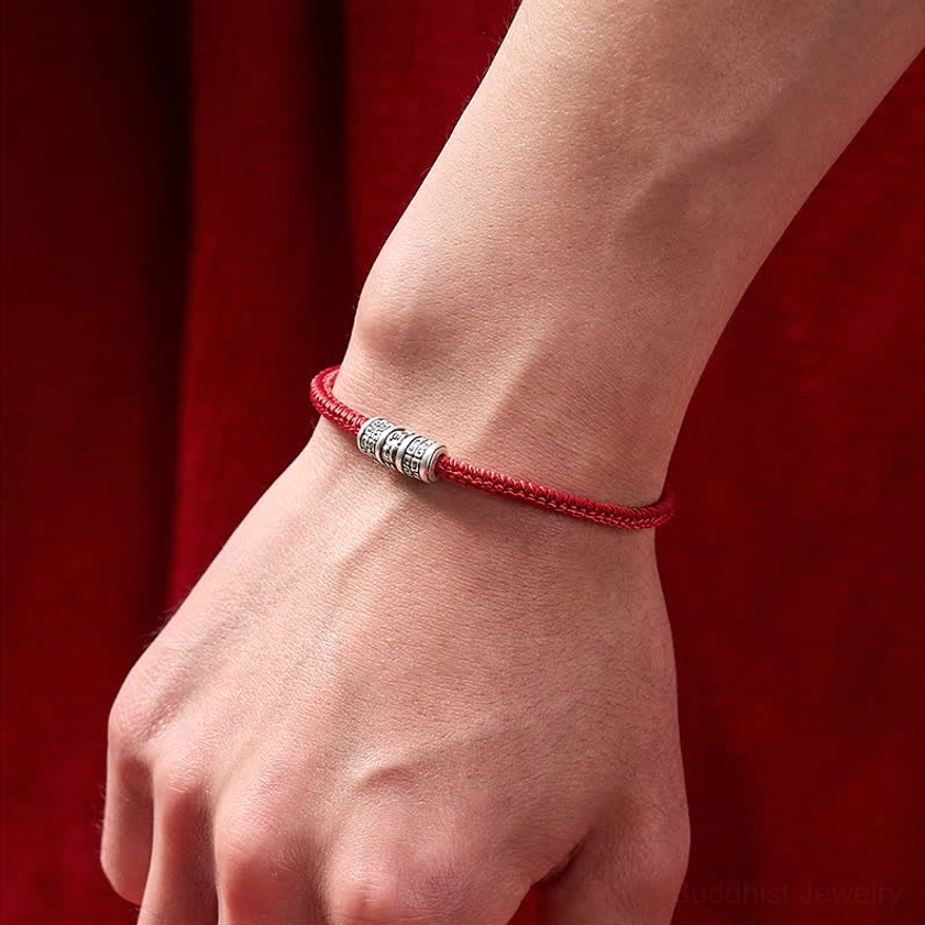 Red string Buddhist protection bracelet gift packaging and presentation image for spiritual jewelry